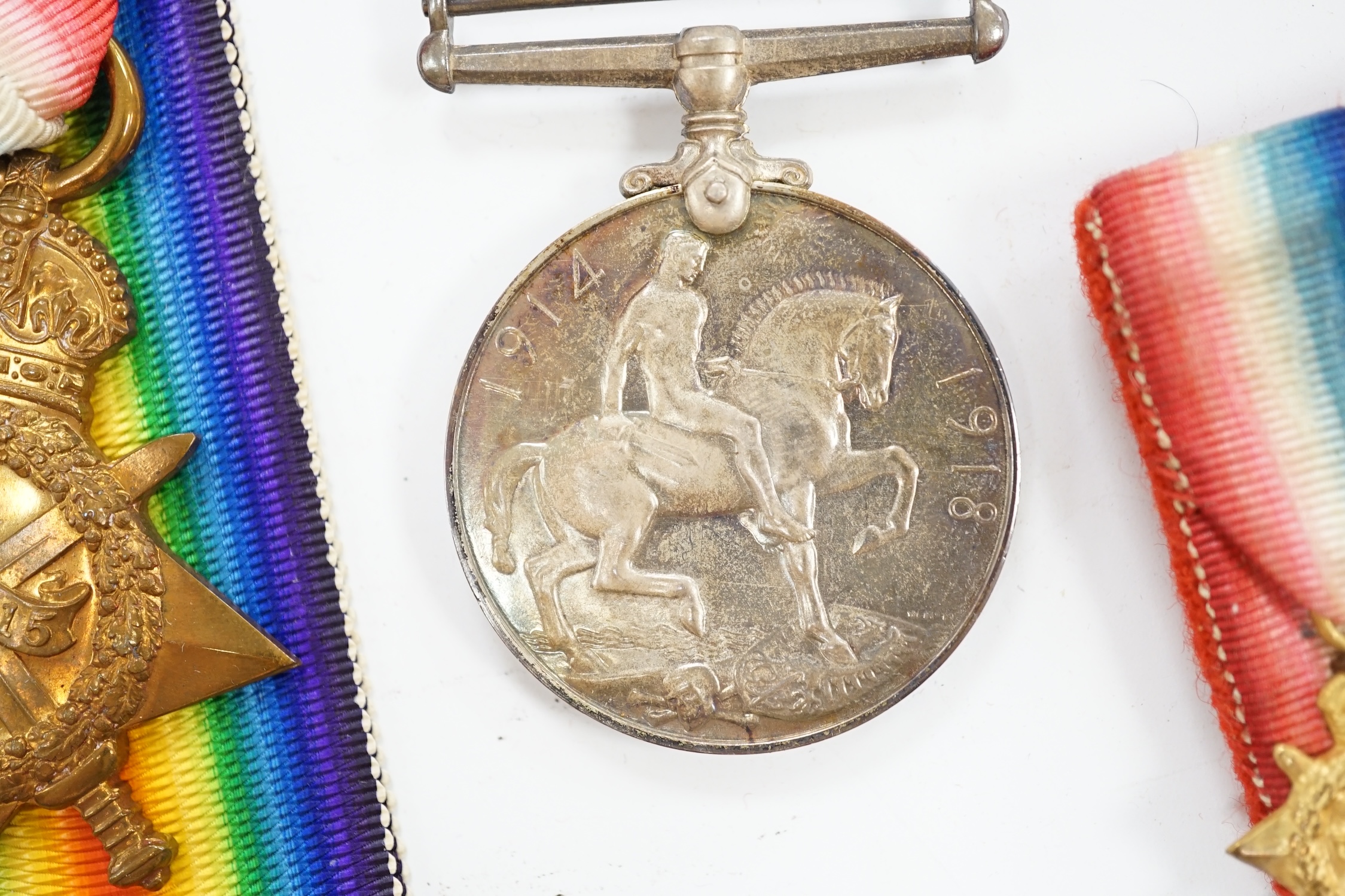 A First World War medal trio awarded to Pte. R.N. Randell, Canadian Forces, together with the miniature set, original card box of issue, the original envelope, paperwork and War Office issued folder. Condition - fair to